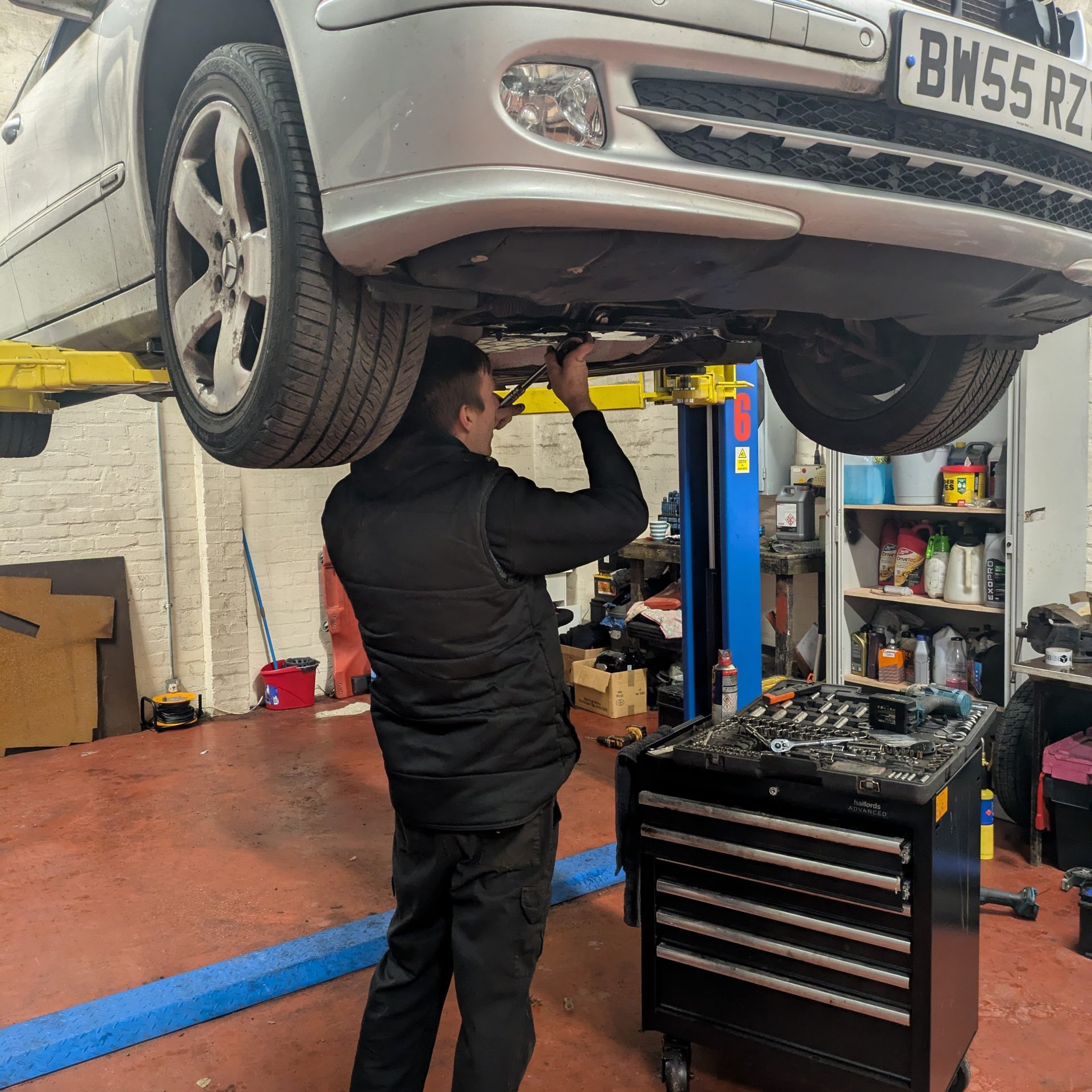 Car Mechanic Working on car