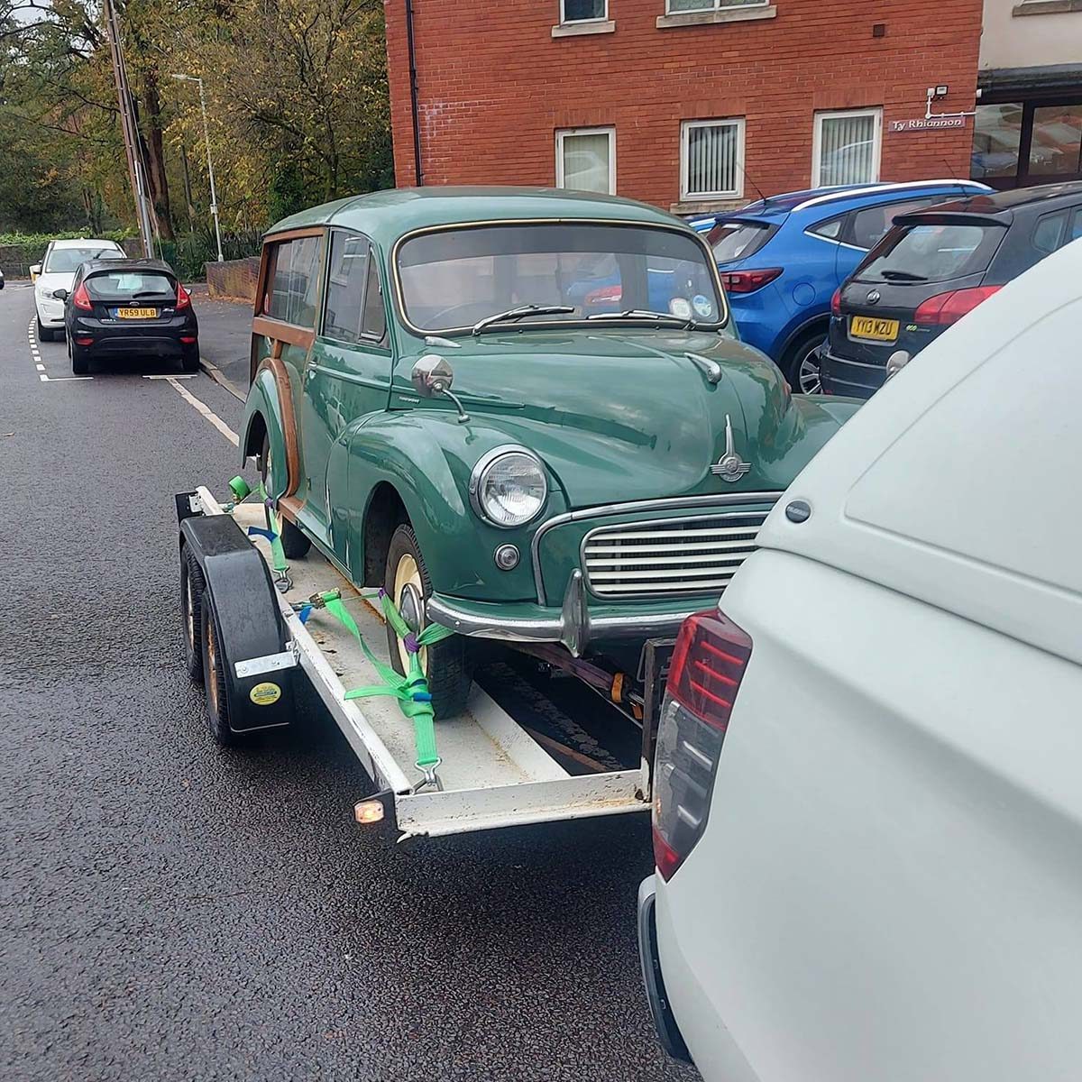 Old green car on trailer