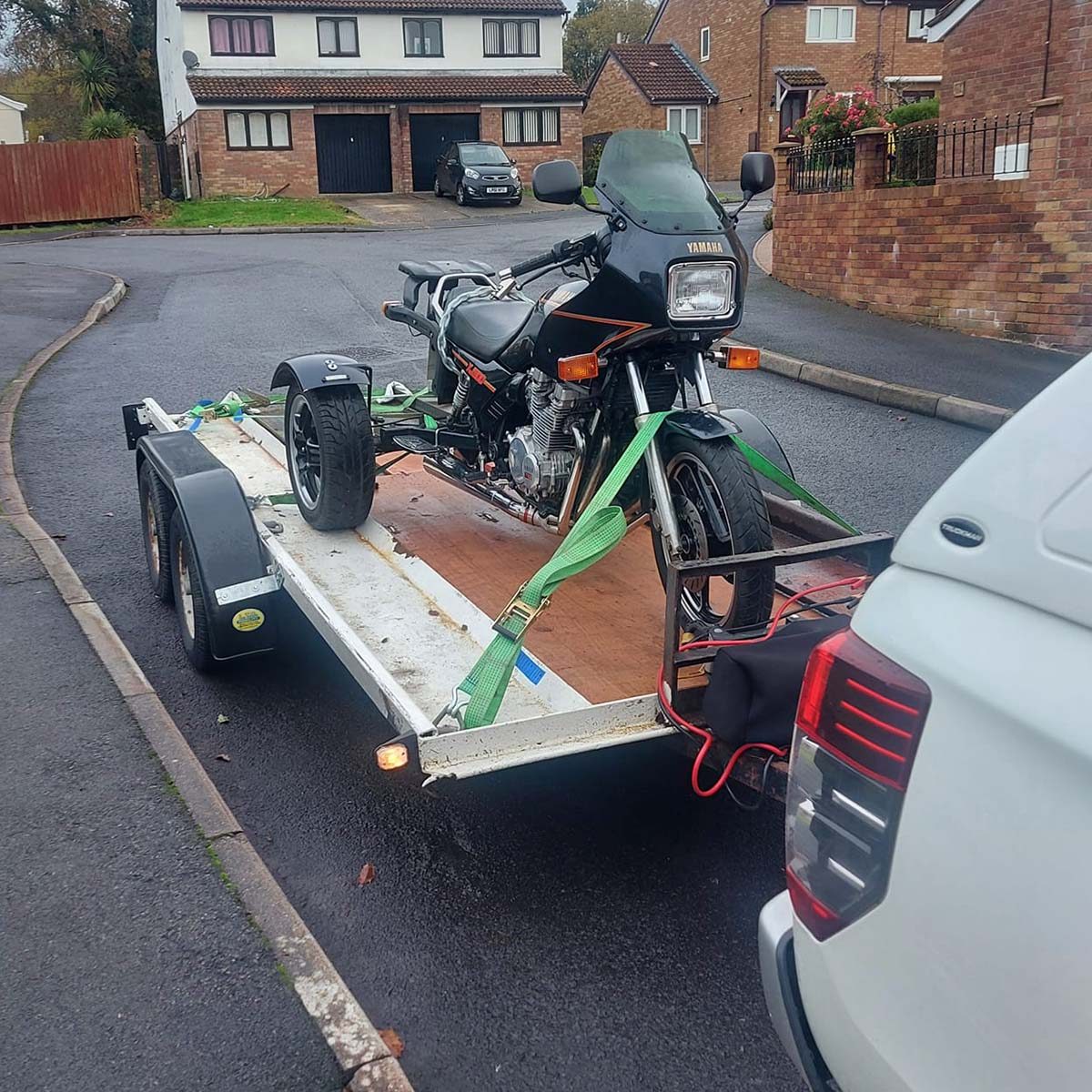 3 wheeled motorbike on trailer